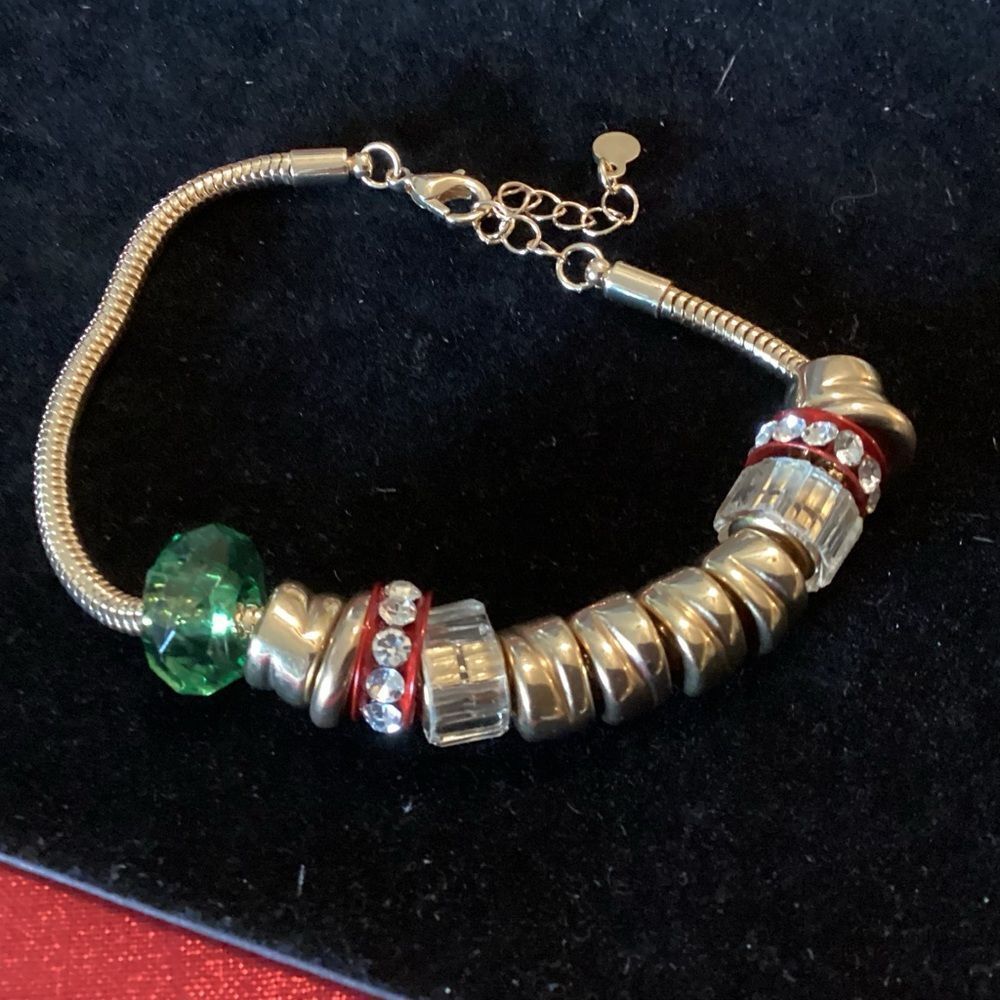 NWOT. Goldtone Snake Link Bracelet with Multiple Charms